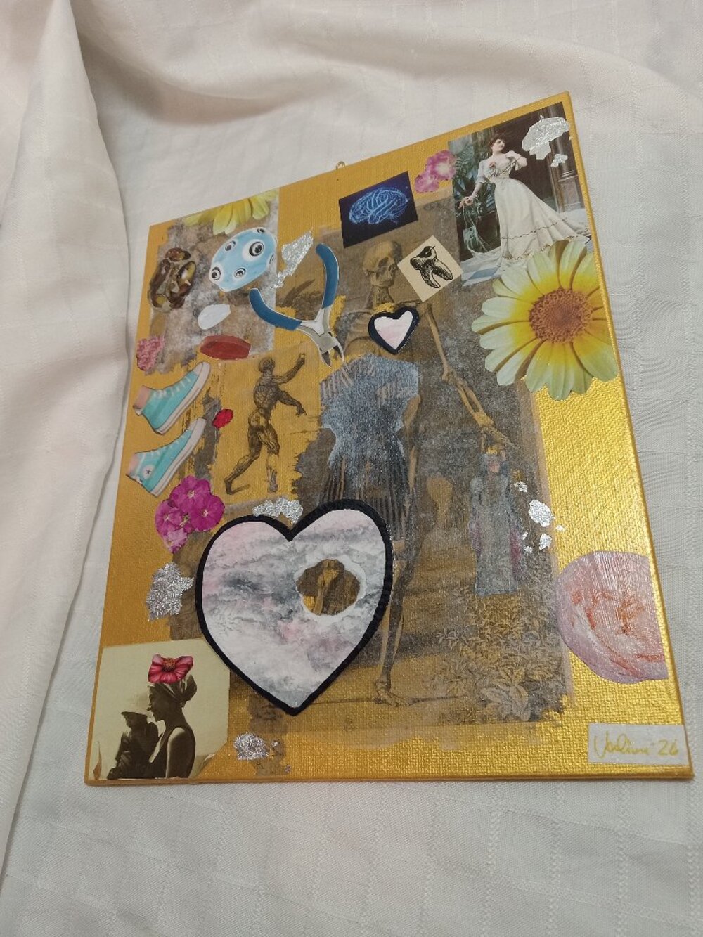 Prints of old magazines on canvas, gold paint, and mixed-media collages